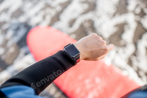 Smart Watch on Beach Surfboard Checking Data