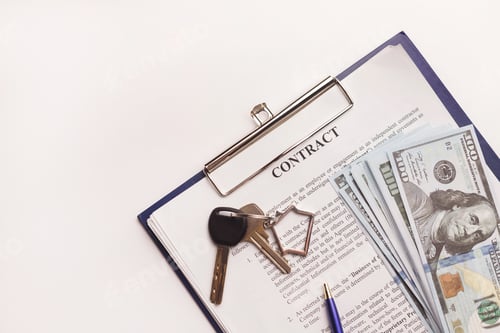 Preview: Real estate purchase contract with money and home keys on white table.