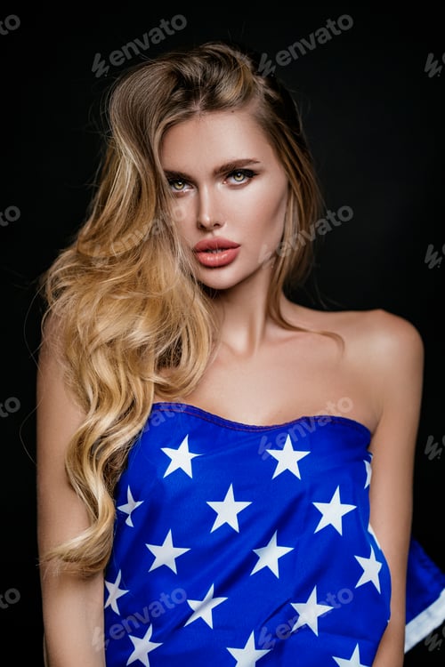 Preview: happy smiling girl hiding herself behind USA national flag. International day of democracy concept