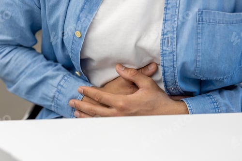 Preview: Close-up photo of a body part, hands of a young Latin American man in a blue shirt holding his