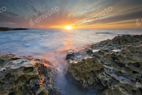 Preview: Beautiful seascape and water reflection at the sunset
