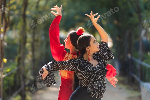 Preview: Pair of female flamenco dancers performing a choreography outdoors