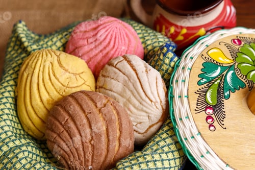Preview: Closeup shot of Mexican bread and a Mexican mug with chocolate
