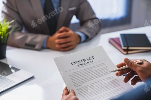 Preview: An employer interviewing for a job or head of HR is reading a resume while discussing the resume. An