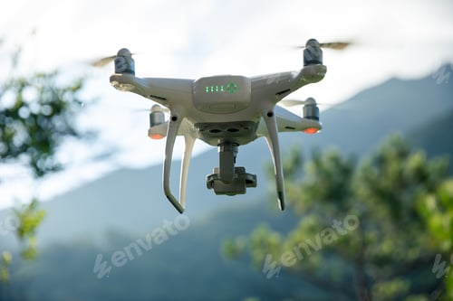 Preview: White drone with camera flying in summer mountains