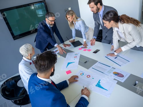 Preview: Diverse happy business people in board room meeting at the office