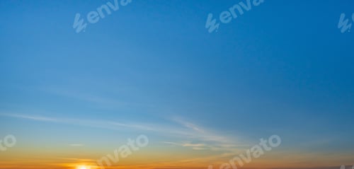Preview: Morning sky scene with a bright golden light. Beautiful sunrise with clouds soft. Nature background