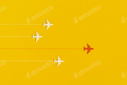 Preview: Toy airplanes on a yellow background. Leadership and new idea concept.