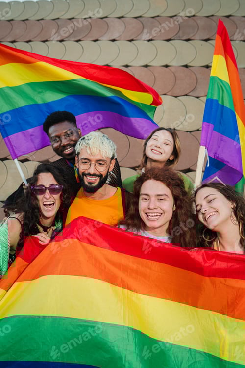 Preview: Vertical multiracial young adult people having fun celebrating gay pride event. Group of diverse