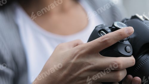 Preview: Photographer using digital camera