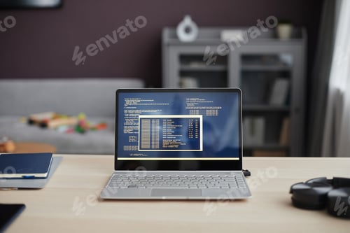 Preview: Background Image of Open Laptop with Code Lines on Screen
