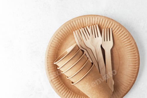 Preview: Eco paper cups and forks on disposable plate over white background flat lay setup