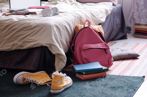 Preview: Backpack And Book In Teenagers Room