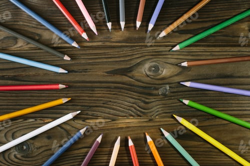 Preview: Multicolored pencils lying on a table