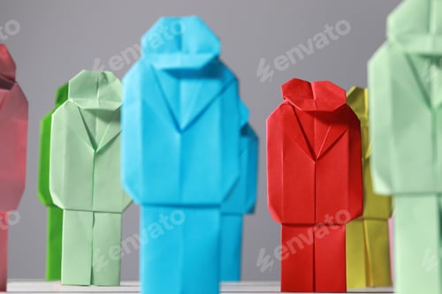 Preview: Many colorful paper figures on table, closeup. Recruiter searching employee