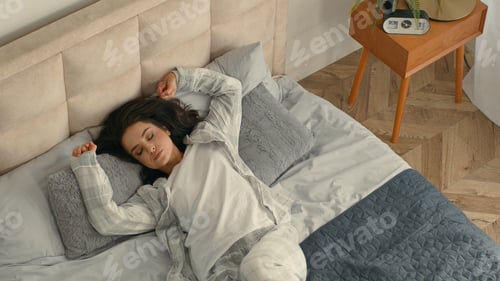 Preview: Top view woman fall on bed lying lazy weekend girl female bedroom home rest relax tired sleep