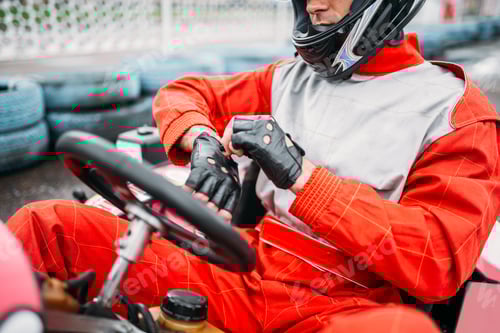 Preview: Go-kart driver in helmet on karting speed track