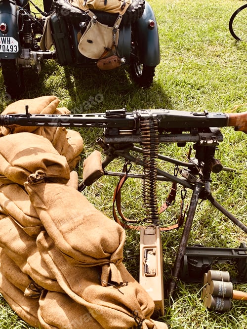 Preview: Antique machine gun used during World War Two with sandbags.
