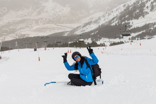 Preview: Skier woman on top of the mountain. Winter season