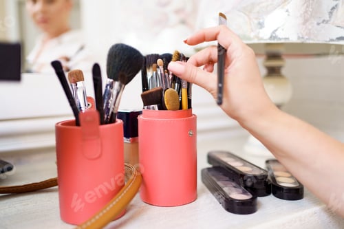 Preview: Make up artist hands working in her beauty visage studio salon with her brushes