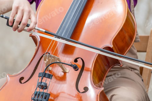 Preview: Closeup shot of a musician gracefully playing the cello