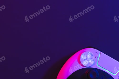 Preview: Composite of video game pad and copy space on neon background