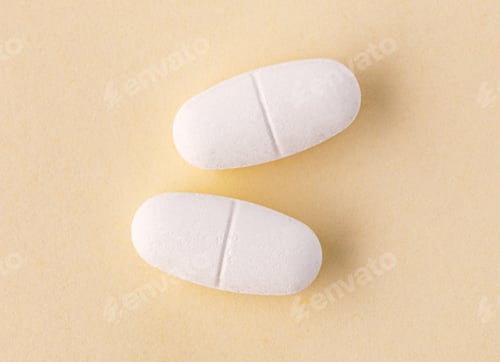 Preview: Two white pills representing health and medicine