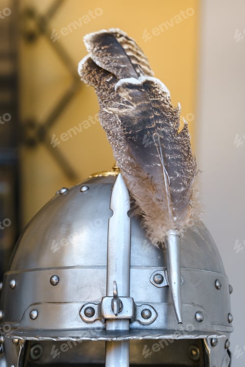 Preview: An ancient knight's helmet with a feather .Medieval concept