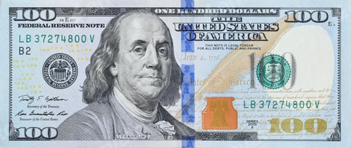 Preview: Portrait of US president Benjamin Franklin on 100 dollars banknote closeup macro fragment