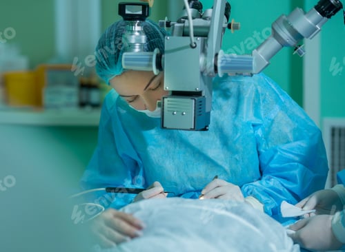 Preview: a young woman ophthalmologist performs an operation on the patient's eye