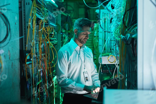 Preview: Mature Network Engineer Setting Up Network