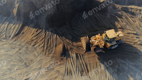 Preview: Aerial top view of the machines at work at the construction site. Scene. Bulldozer and truck working