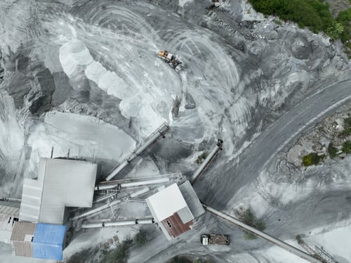 Preview: Aerial view of granite and limestone crushing plant with dump trucks and excavators processing raw