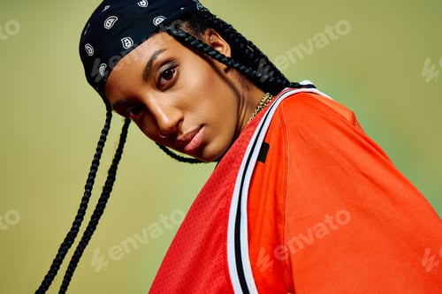Preview: Fashionable young woman showcases her unique style with confidence and flair in a dynamic setting