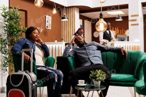 Preview: Exhausted tourists rest in hotel lobby