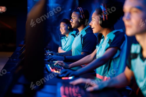 Preview: Team of professional gamers playing on pc in gaming club