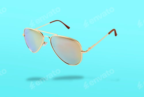 Preview: Stylish sunglasses in air on cyan background