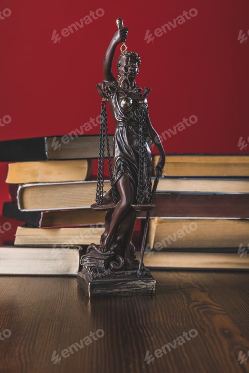 Preview: statue lady justice on wooden table with books, law concept