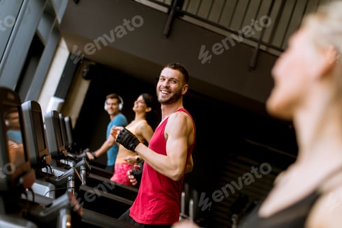 Preview: young people running on treadmills in modern gym