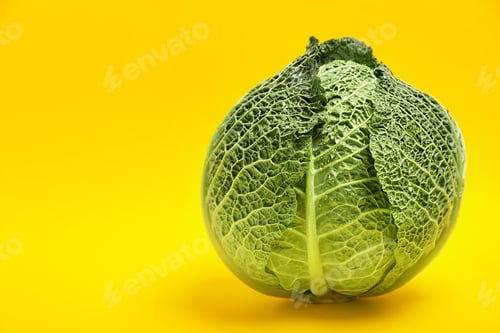 Preview: Fresh green savoy cabbage and space for text on color background