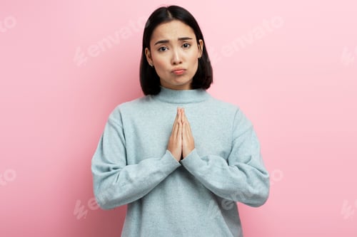 Preview: Portrait of attractive woman praying, begging with pleading grimace