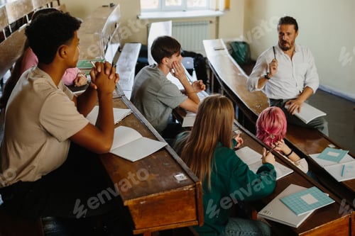 Preview: Students and Teacher Engaged in a Classroom Discussion in Lecture Hall