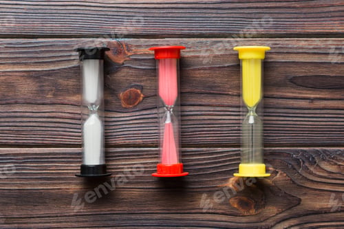 Preview: hourglass on the table, sand clock as time passing concept for business deadline, copy space