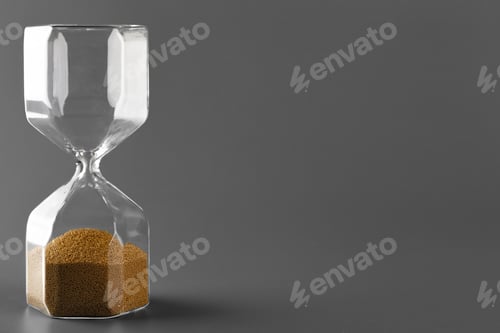 Preview: Hourglass with sand on gray background close up