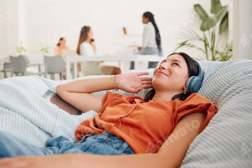 Preview: Relaxing, carefree and listening to music with a young business woman thinking, resting and lying i