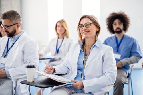 Preview: Group of doctors on conference, medical team sitting and listening