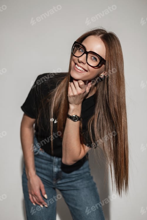 Preview: Smiling Woman in Glasses Poses in Studio