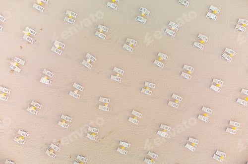 Preview: Aerial view of empty sandy beach with beach umbrellas and chairs at summer day. Black sea, Bulgaria
