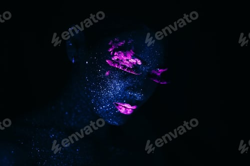 Preview: Portrait of Fashion Woman in Neon UV Light. Model with Fluorescent Creative Psychedelic Make Up