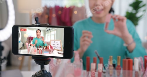 Preview: Asia woman micro influencer record live viral video camera at home studio.
